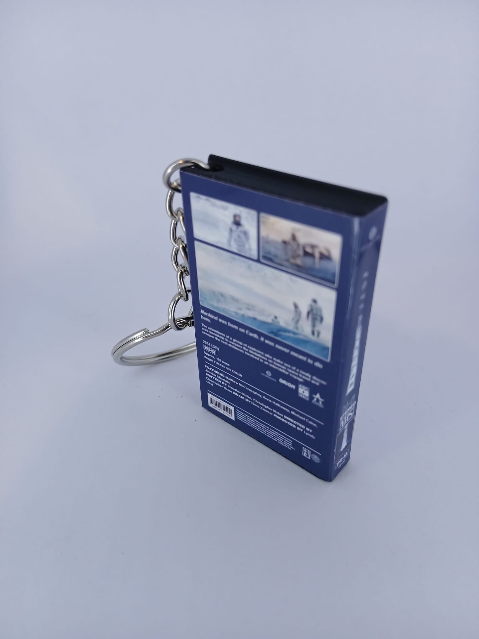 Interstellar VHS keyring — back cover standing angled