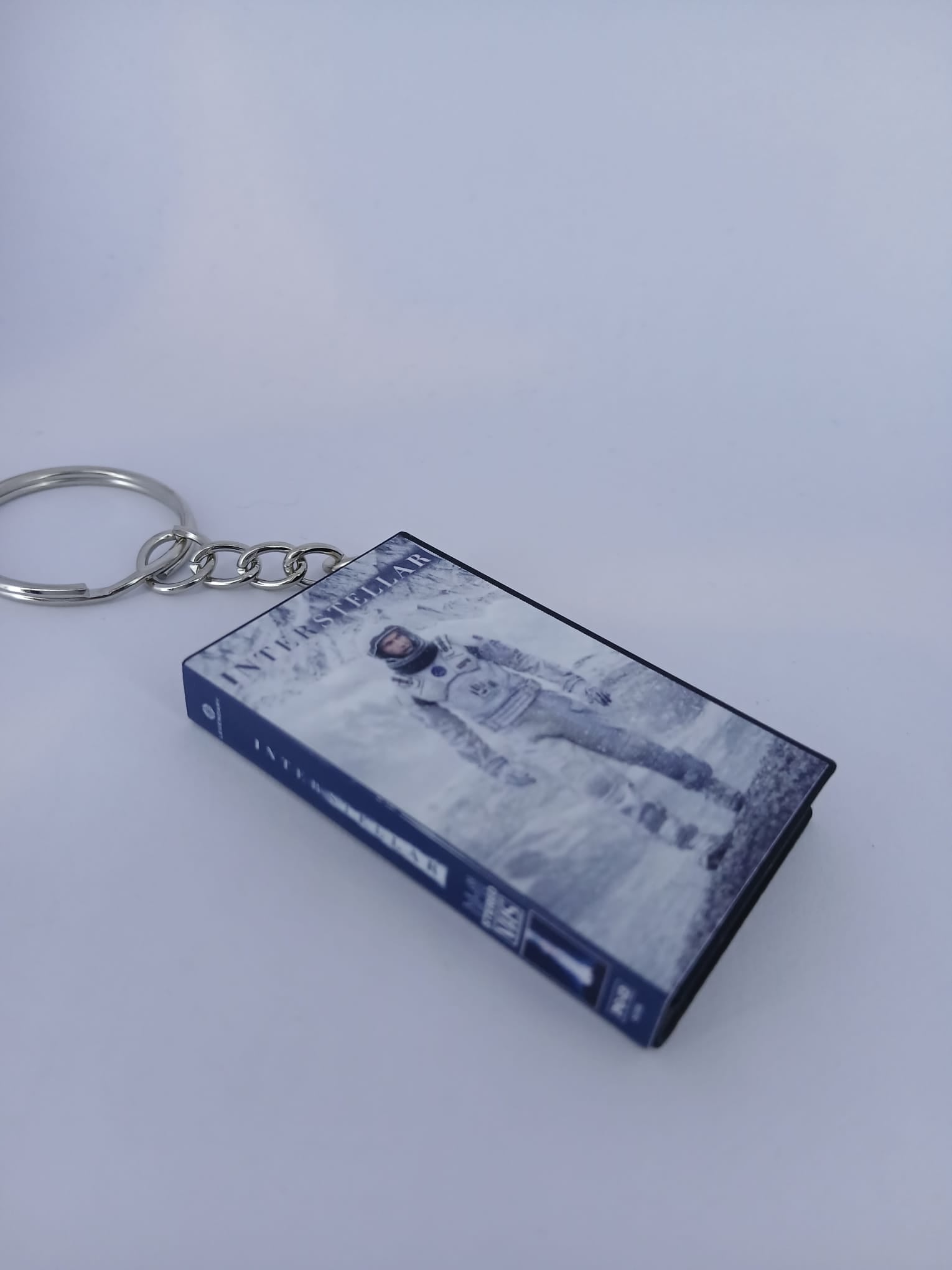 Interstellar VHS keyring — front cover flat lay angled