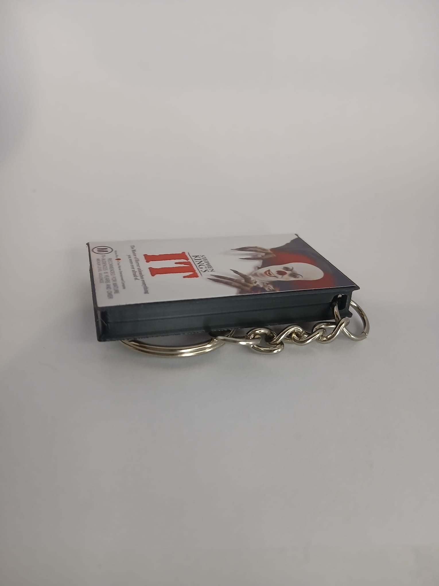 Stephen King's IT VHS keyring — front cover standing angled 2