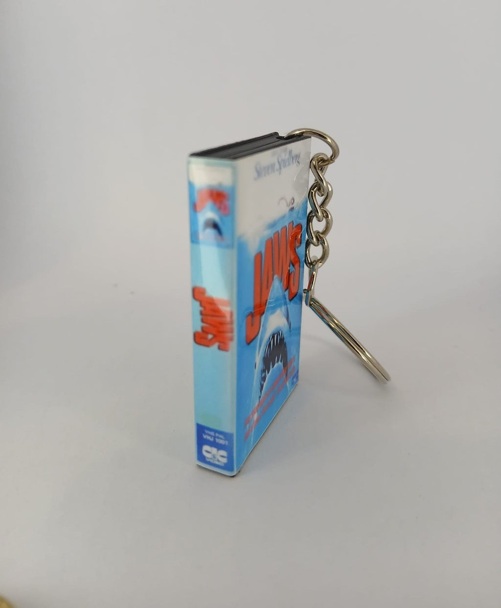 Jaws VHS keyring — back cover angled view standing