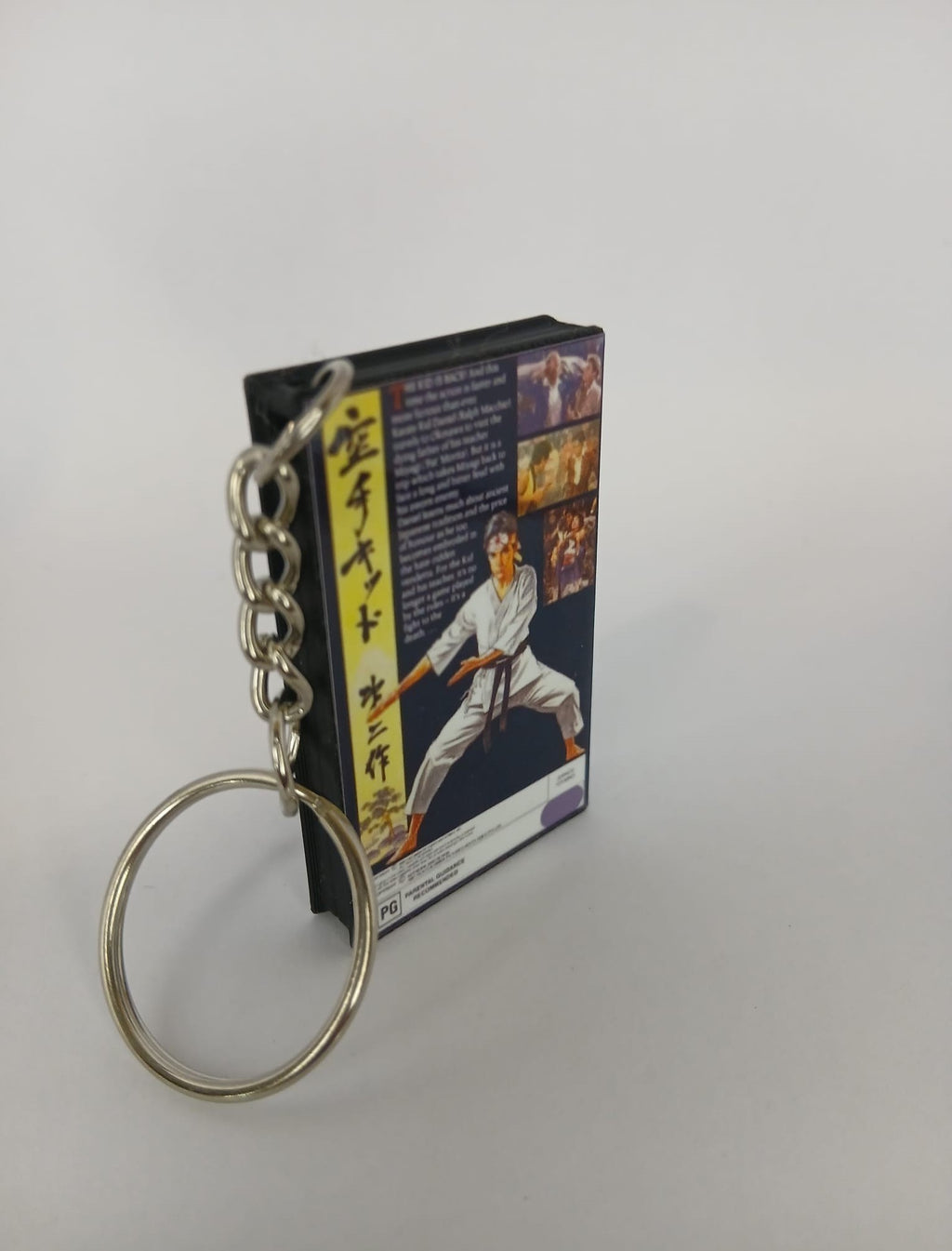 The Karate Kid Part II VHS keyring — back cover angled view standing