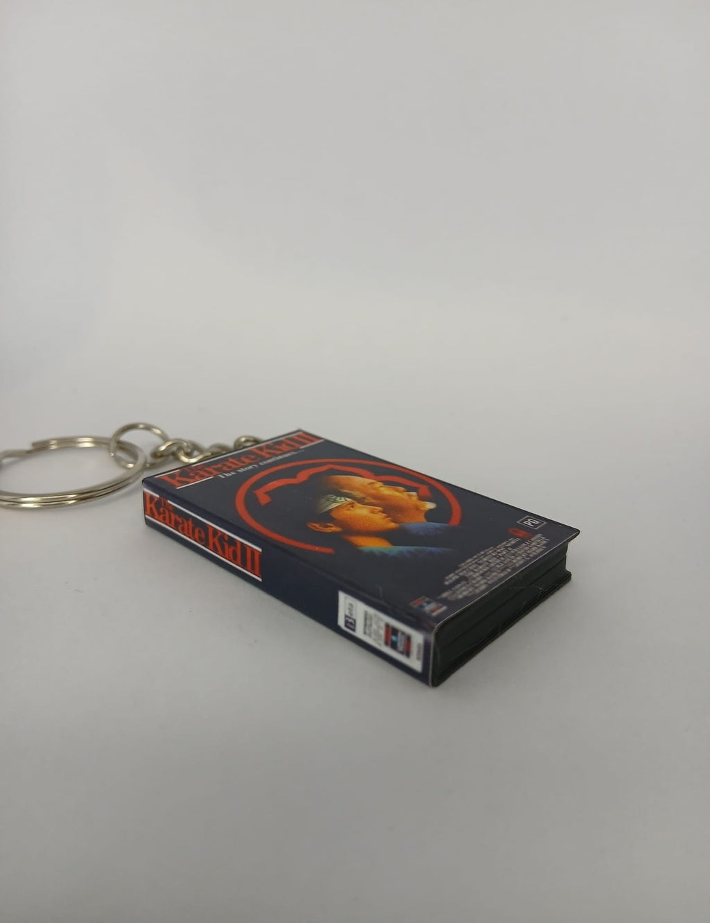 The Karate Kid Part II VHS keyring — front cover standing angled