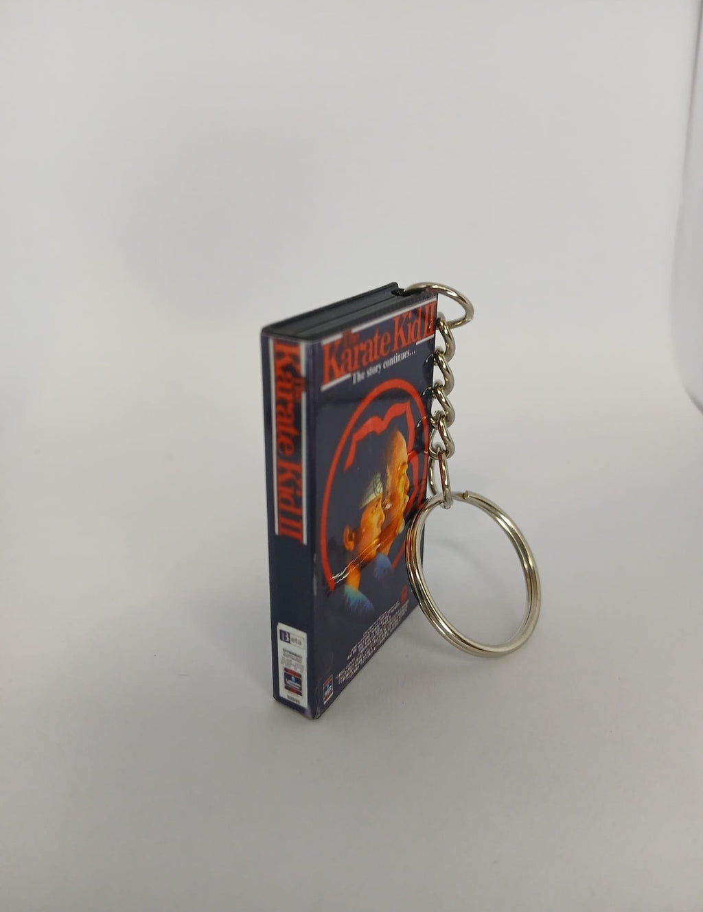 The Karate Kid Part II VHS keyring — front cover standing angled 2