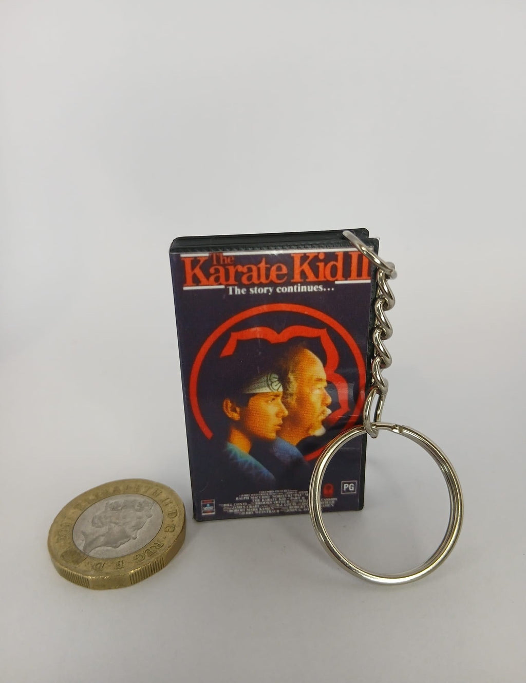 The Karate Kid Part II VHS keyring — spine view standing