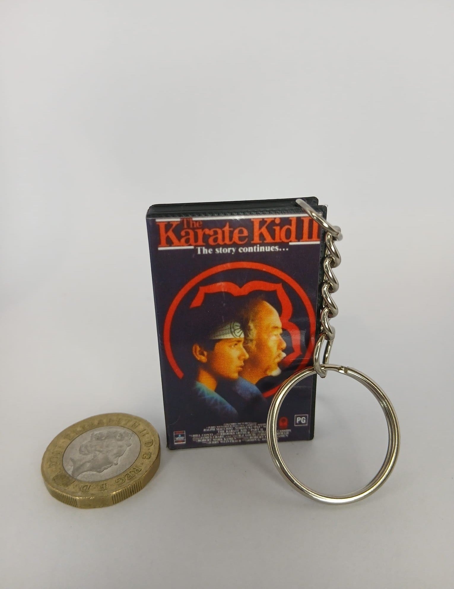 The Karate Kid Part II VHS keyring — spine view standing