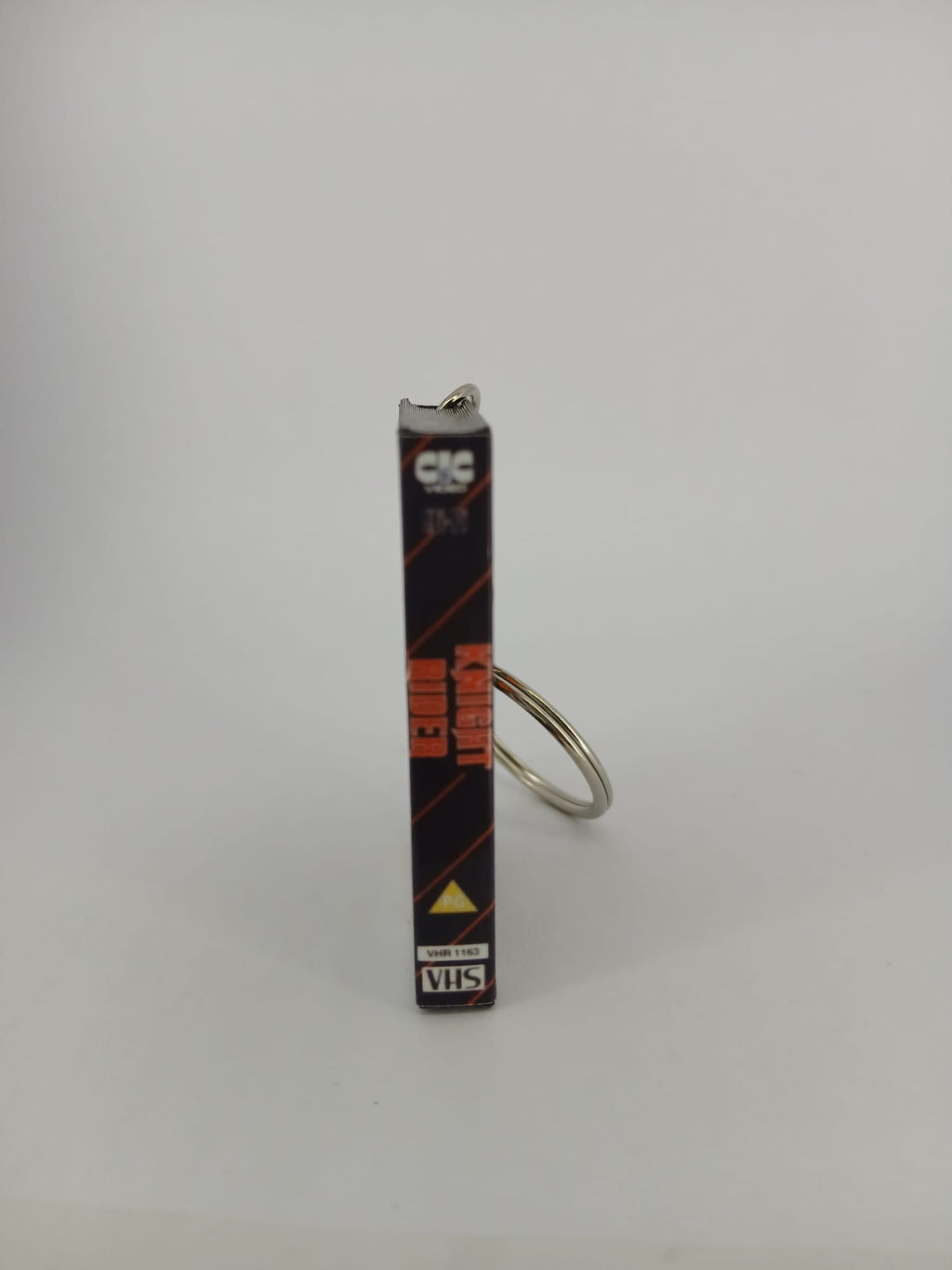 Knight Rider VHS keyring — back cover angled view standing