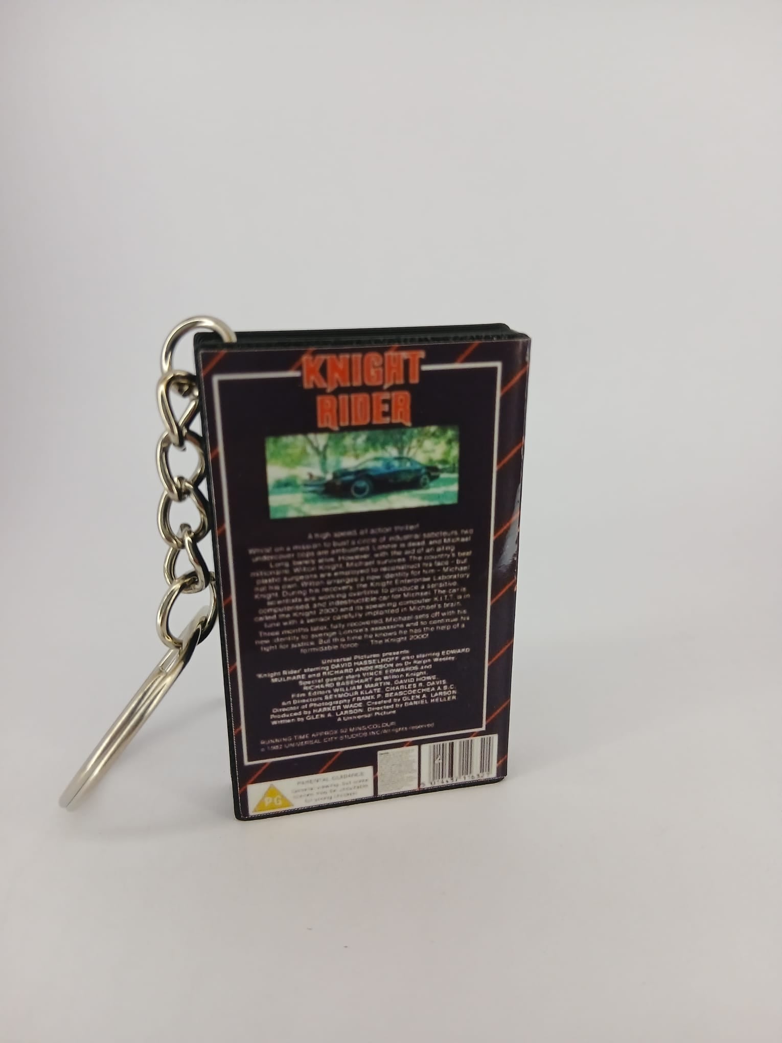 Knight Rider VHS keyring — front and spine angled view standing