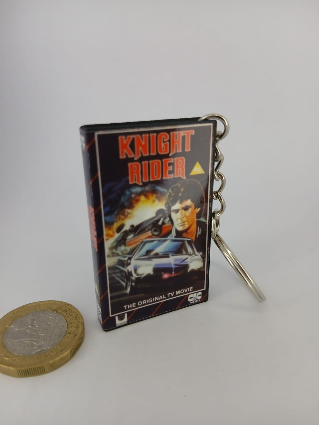 Knight Rider VHS keyring — front cover standing with coin for scale