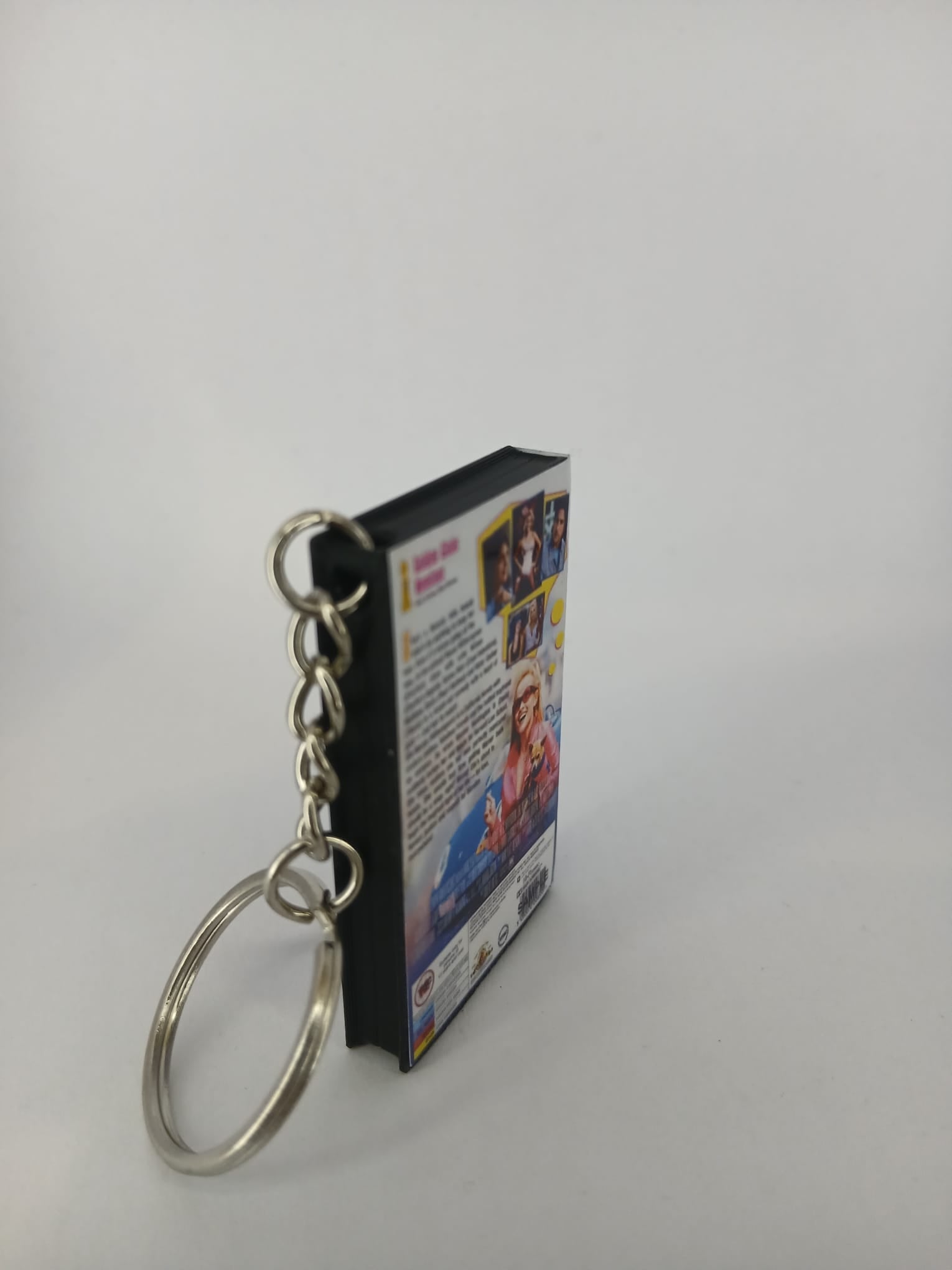 Legally Blonde VHS keyring — front cover flat lay angled