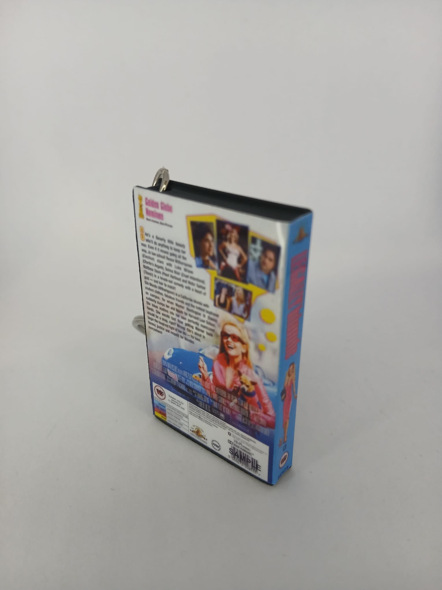 Legally Blonde VHS keyring — front cover angled standing