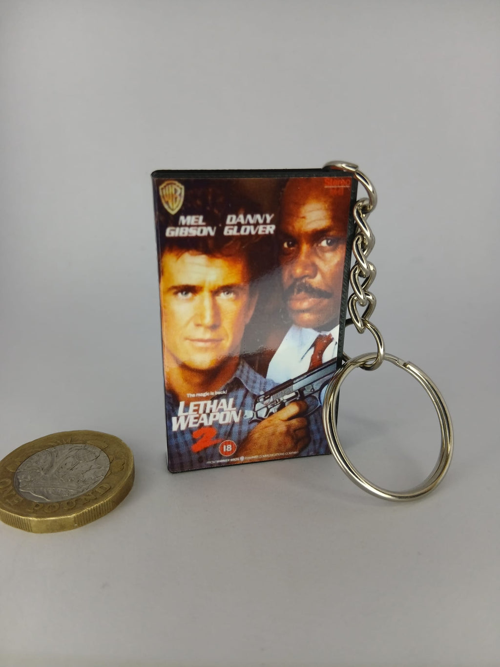 Lethal Weapon 2 Mini VHS Keyring – scale with coin standing