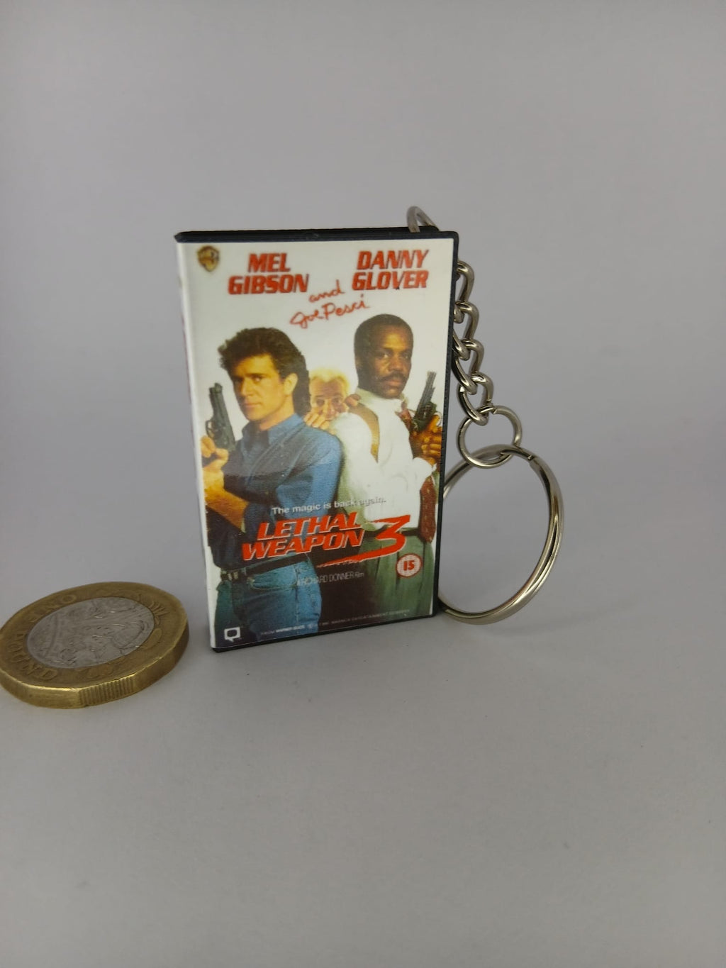 Lethal Weapon 3 Mini VHS Keyring – scale with coin standing