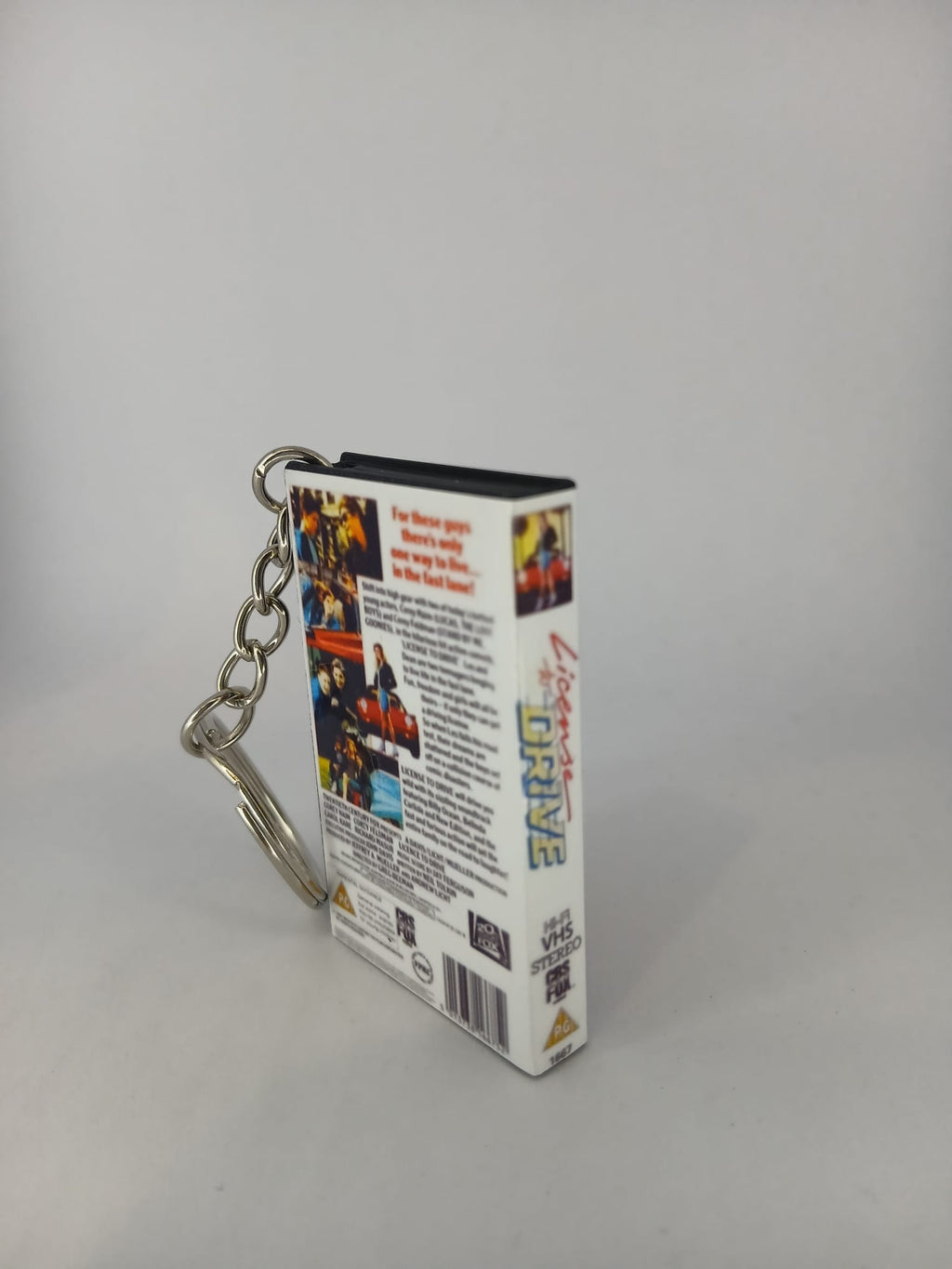 Licence to Drive VHS keyring — front cover flat lay angled
