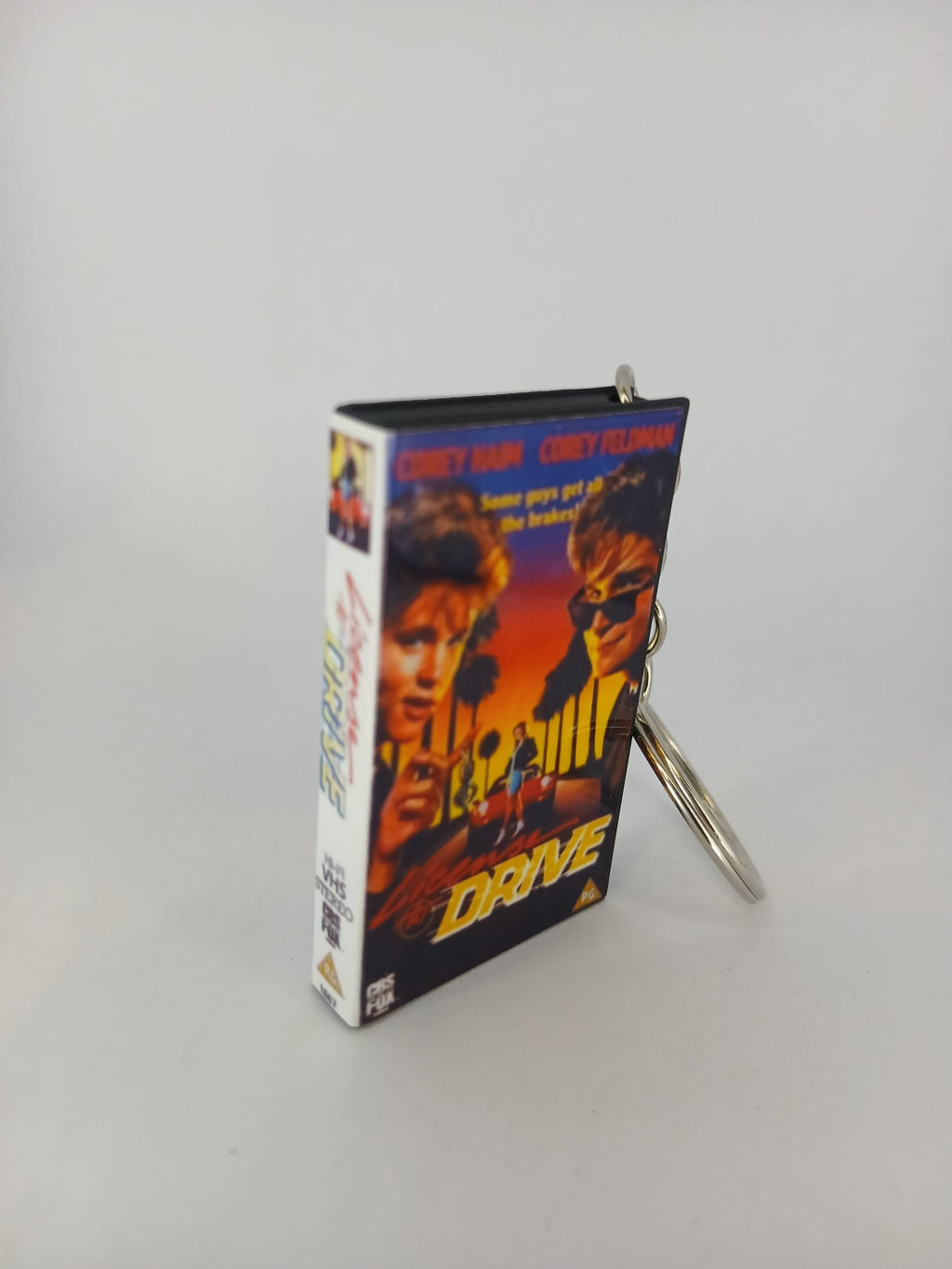 Licence to Drive VHS keyring — front cover standing