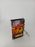 Licence to Drive VHS keyring — front cover with £1 coin for scale