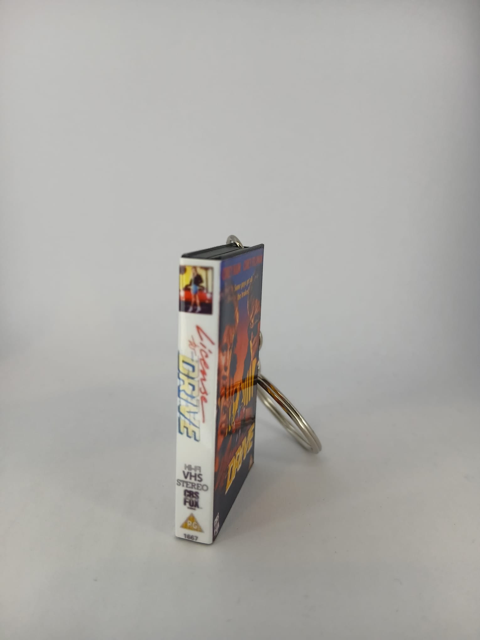 Licence to Drive VHS keyring — back cover spine view