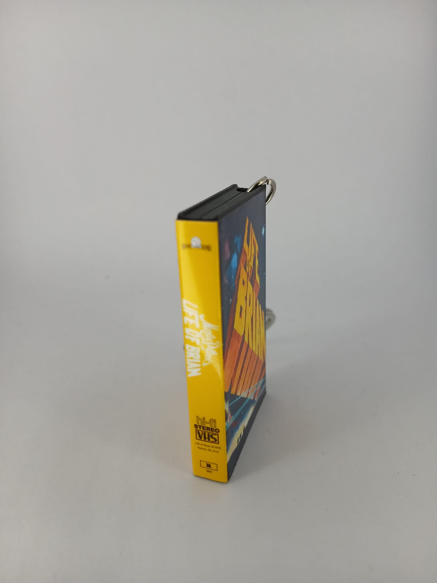 Monty Python's Life of Brian VHS keyring — back cover standing angled