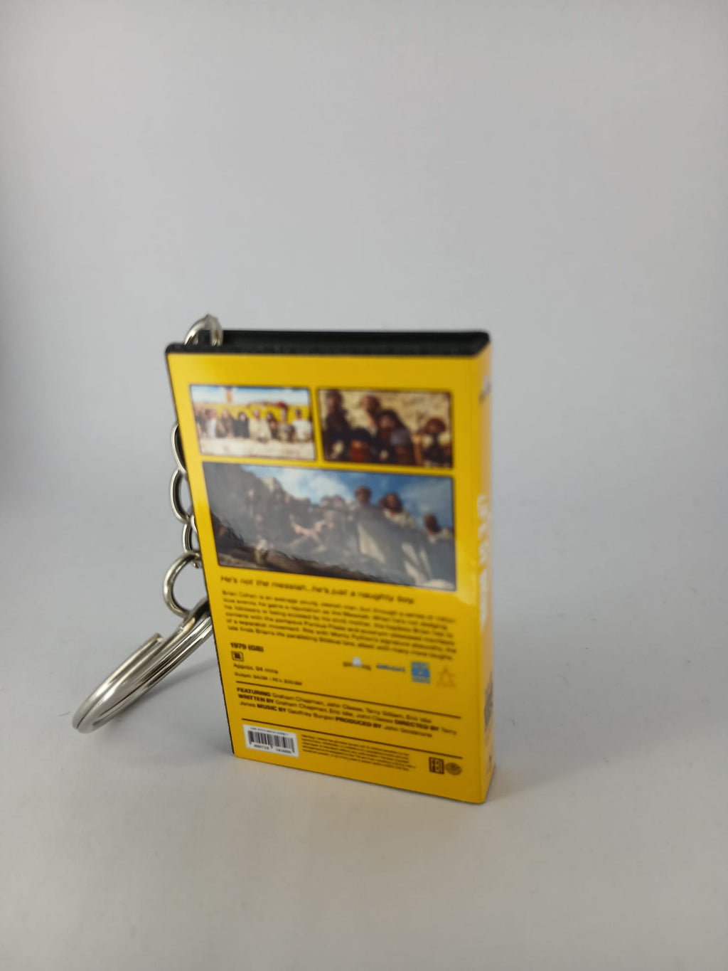Monty Python's Life of Brian VHS keyring — front cover flat lay angled