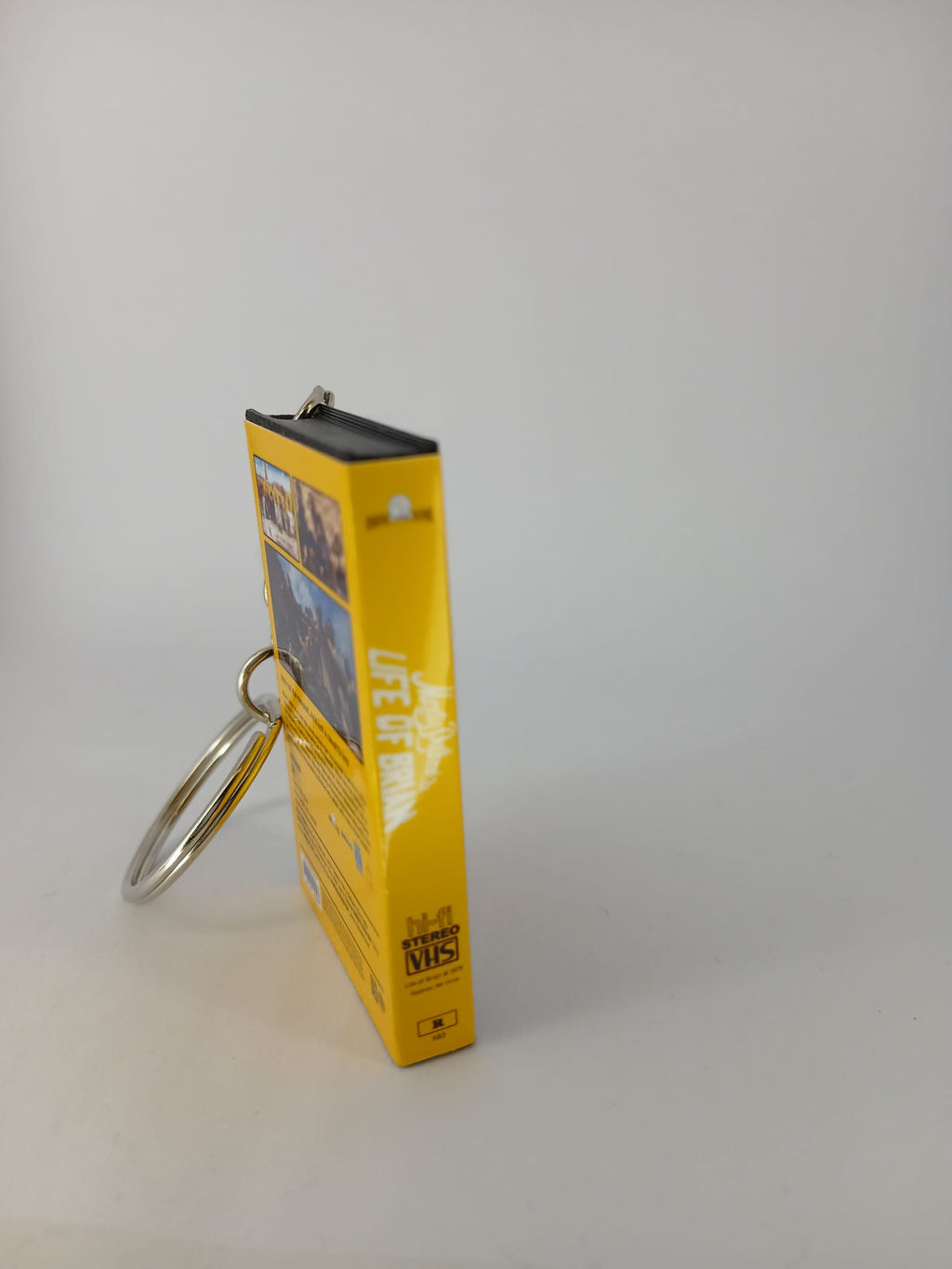 Monty Python's Life of Brian VHS keyring — front cover standing angled