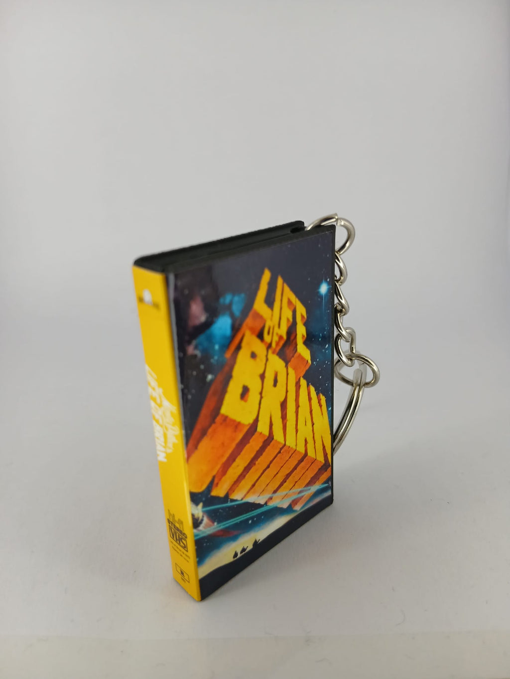 Monty Python's Life of Brian VHS keyring — front cover close-up angled