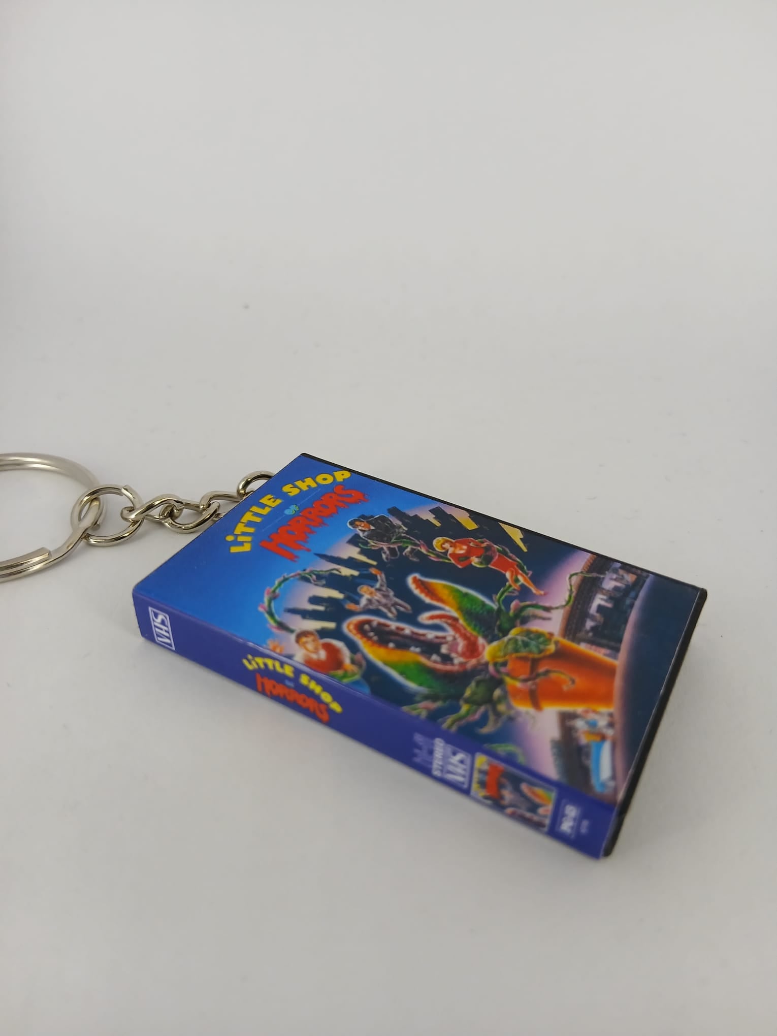 Little Shop of Horrors VHS keyring — back and spine angled view