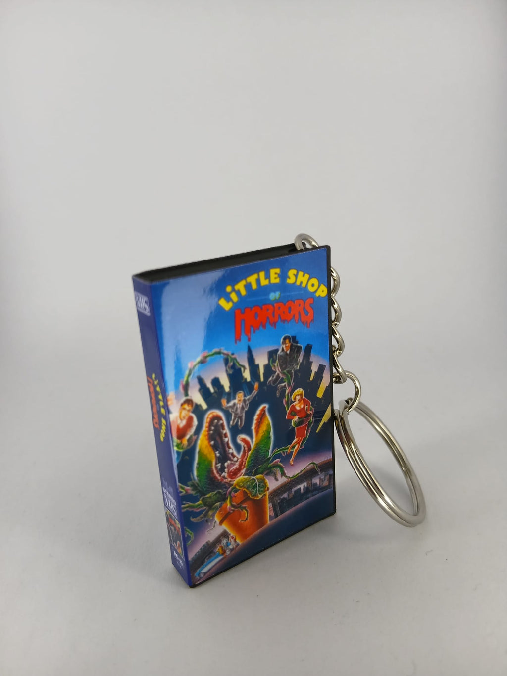 Little Shop of Horrors VHS keyring — front cover close-up angled