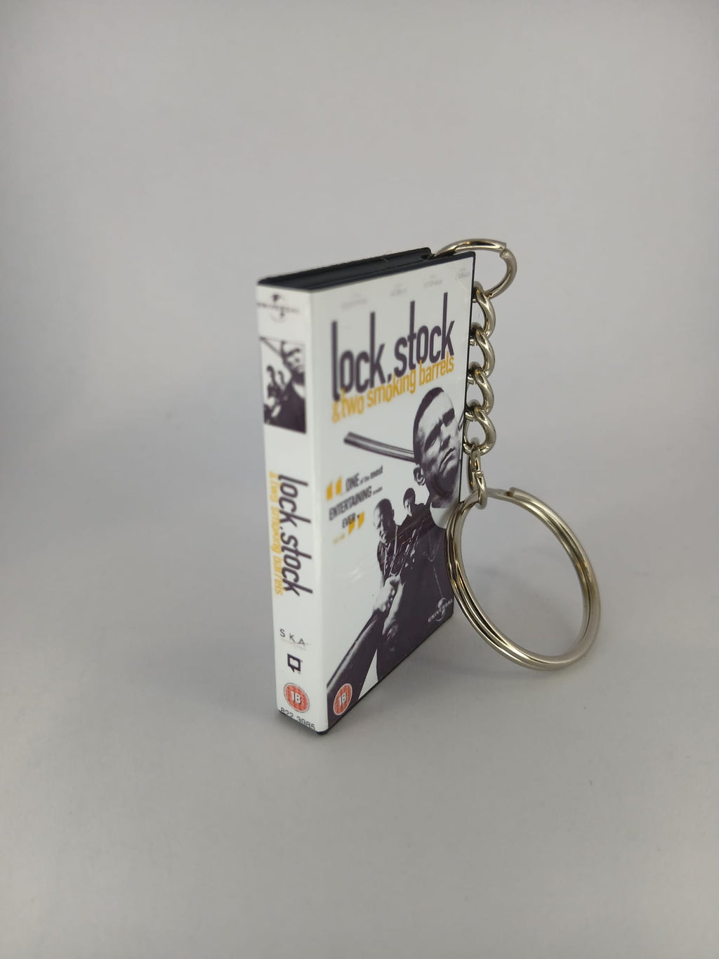Lock, Stock and Two Smoking Barrels Mini VHS Keyring – front with coin standing