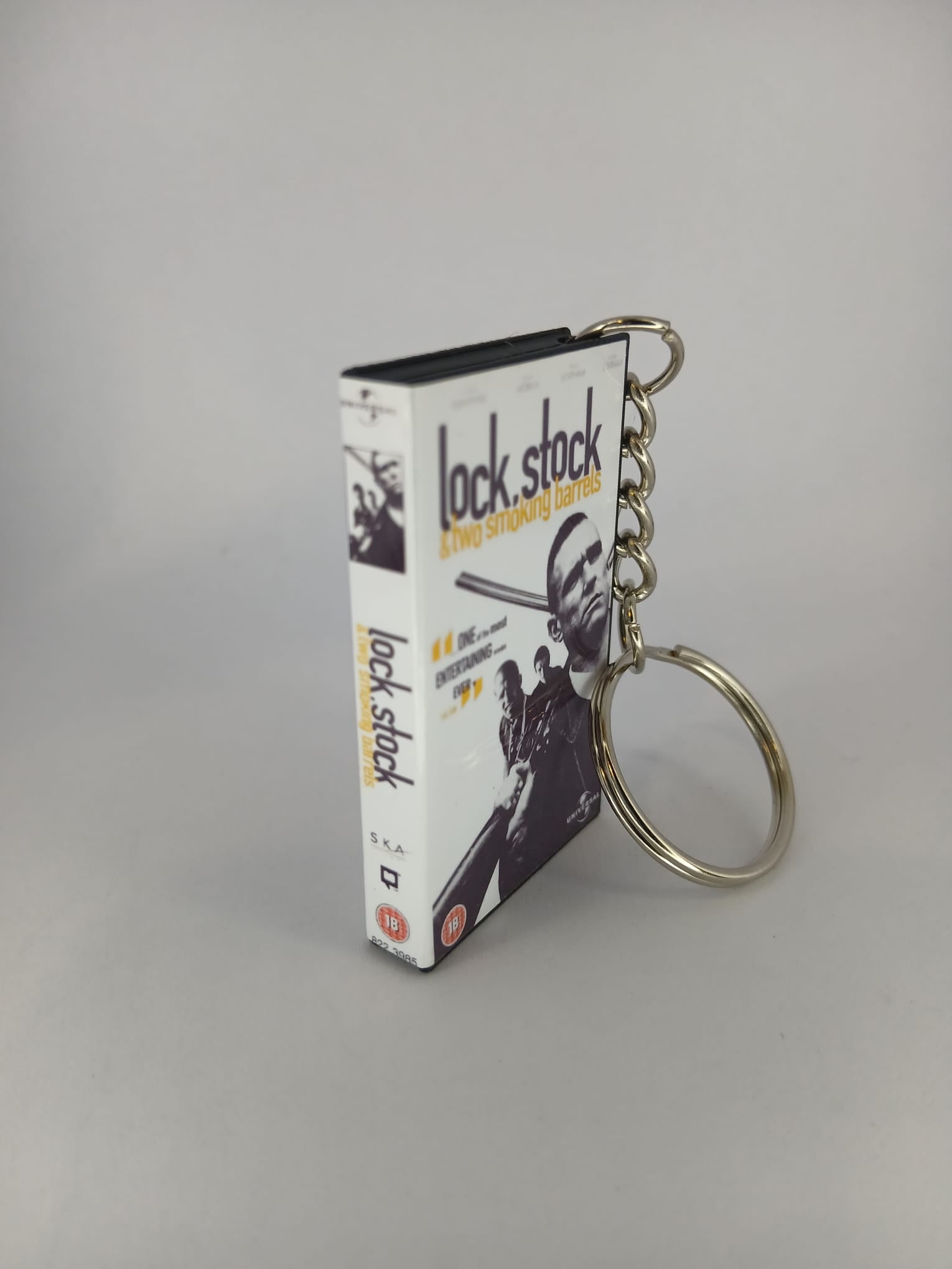 Lock, Stock and Two Smoking Barrels Mini VHS Keyring – front with coin standing