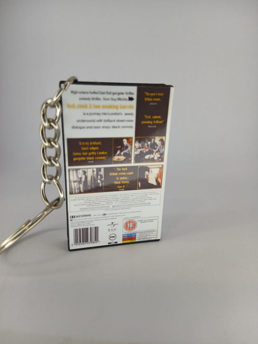 Lock, Stock and Two Smoking Barrels Mini VHS Keyring – flat lay overhead