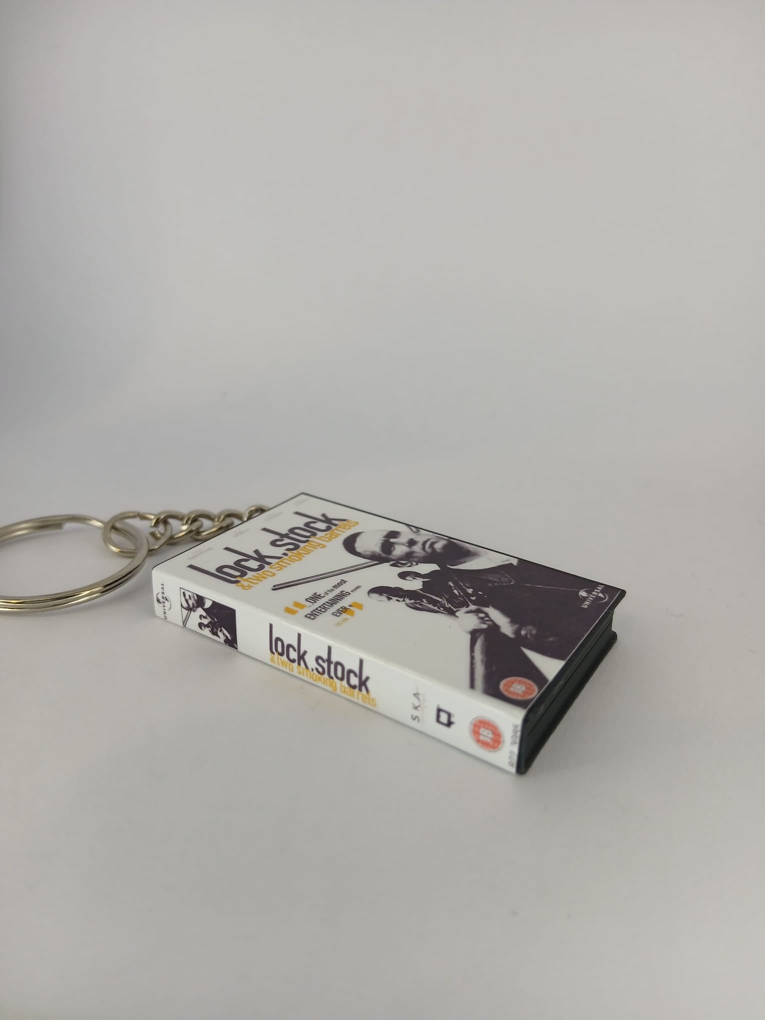 Lock, Stock and Two Smoking Barrels Mini VHS Keyring – flat lay side angle