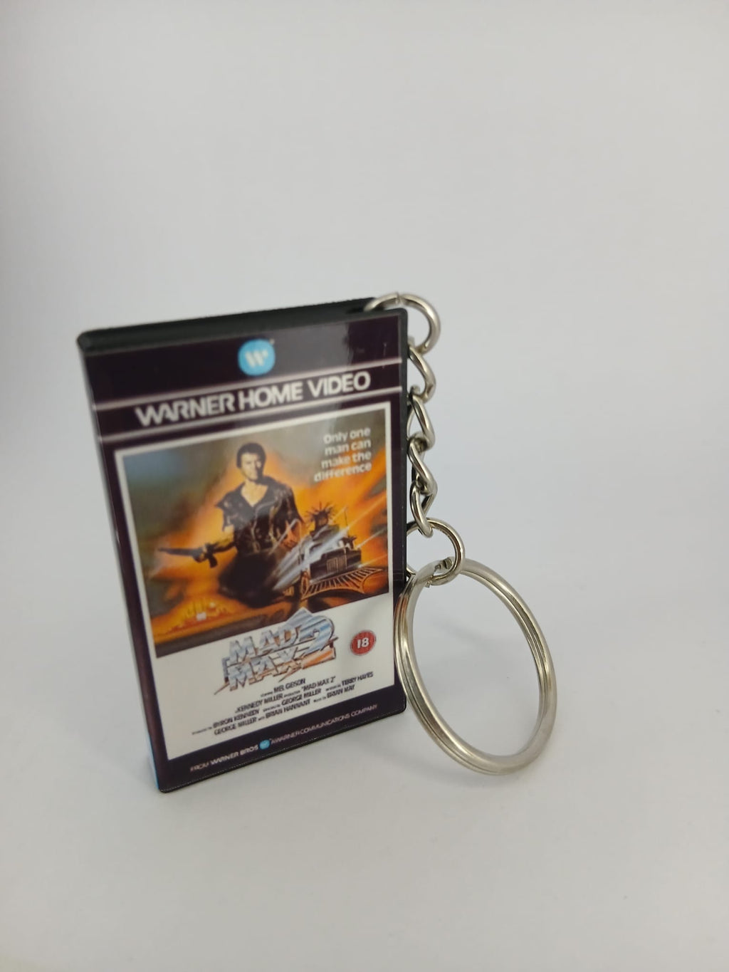 Mad Max 2 VHS keyring — back cover angled view standing