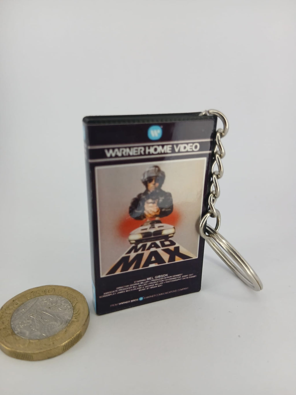 Mad Max VHS keyring — back cover angled view standing