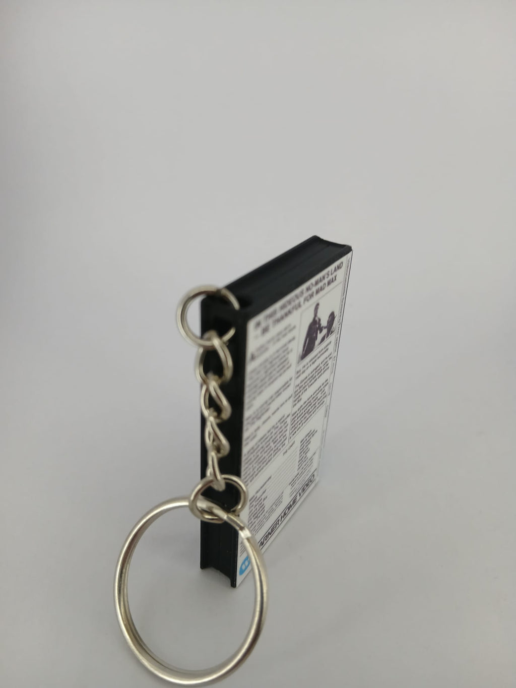 Mad Max VHS keyring — back cover standing angled 2