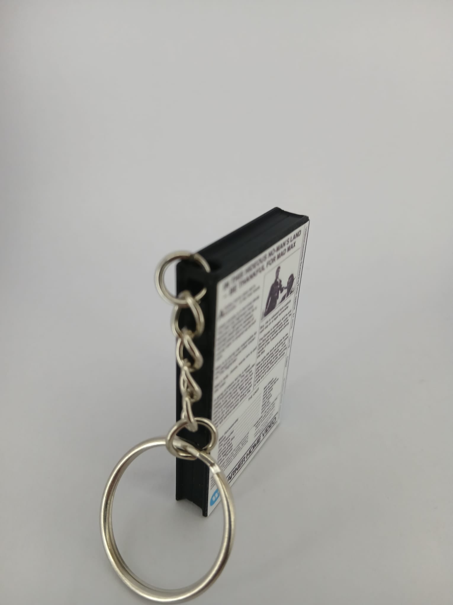 Mad Max VHS keyring — back cover standing angled 2