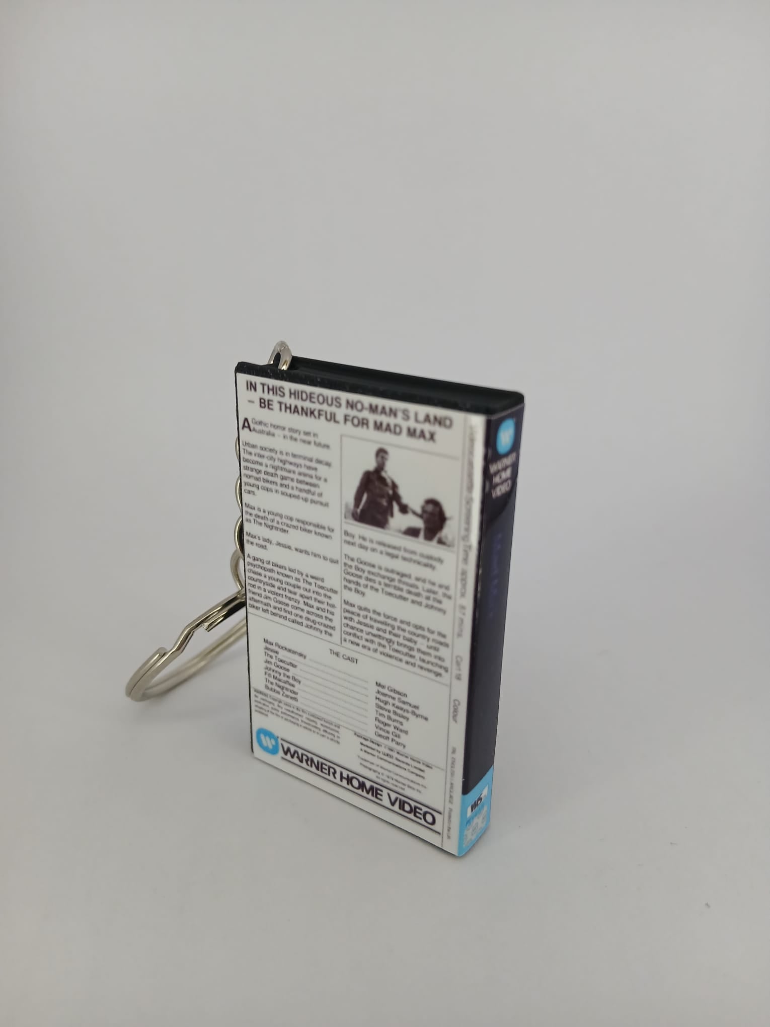 Mad Max VHS keyring — flat lay front cover angled