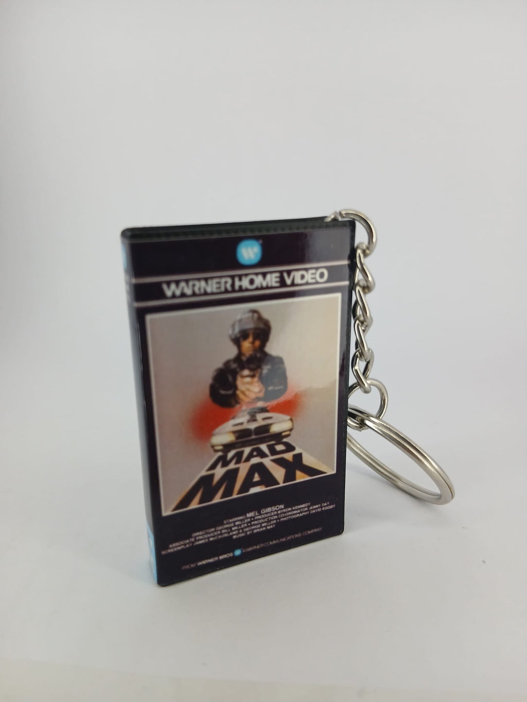 Mad Max VHS keyring — front and spine angled view standing