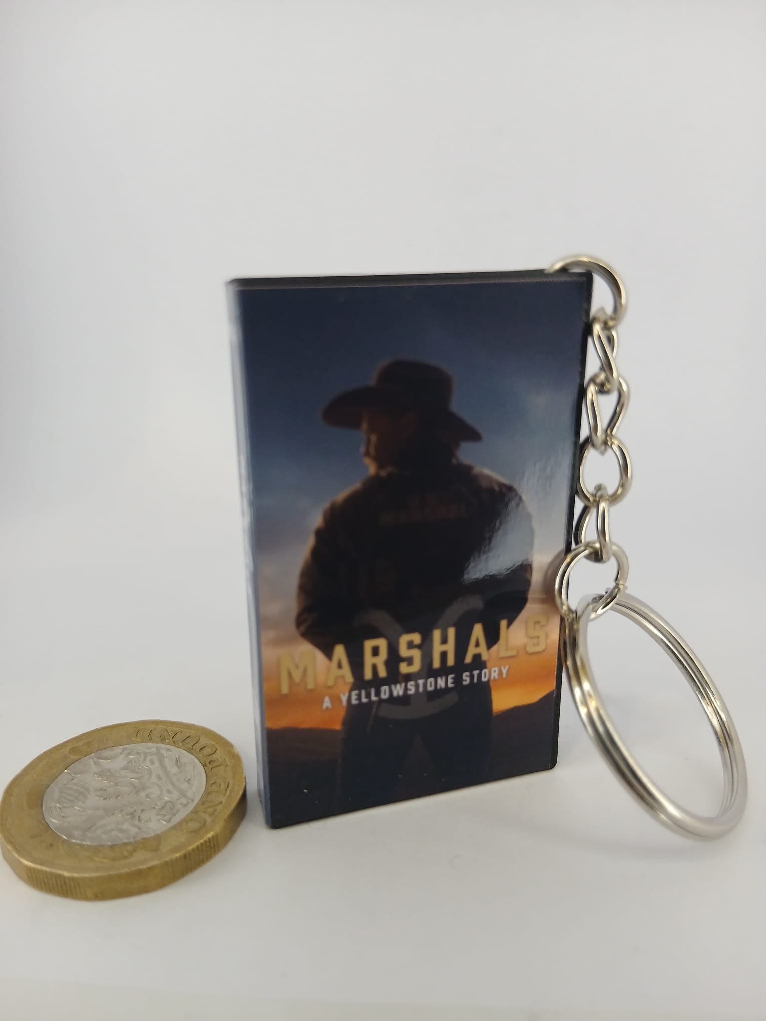Marshals: A Yellowstone Story VHS keyring — spine view standing