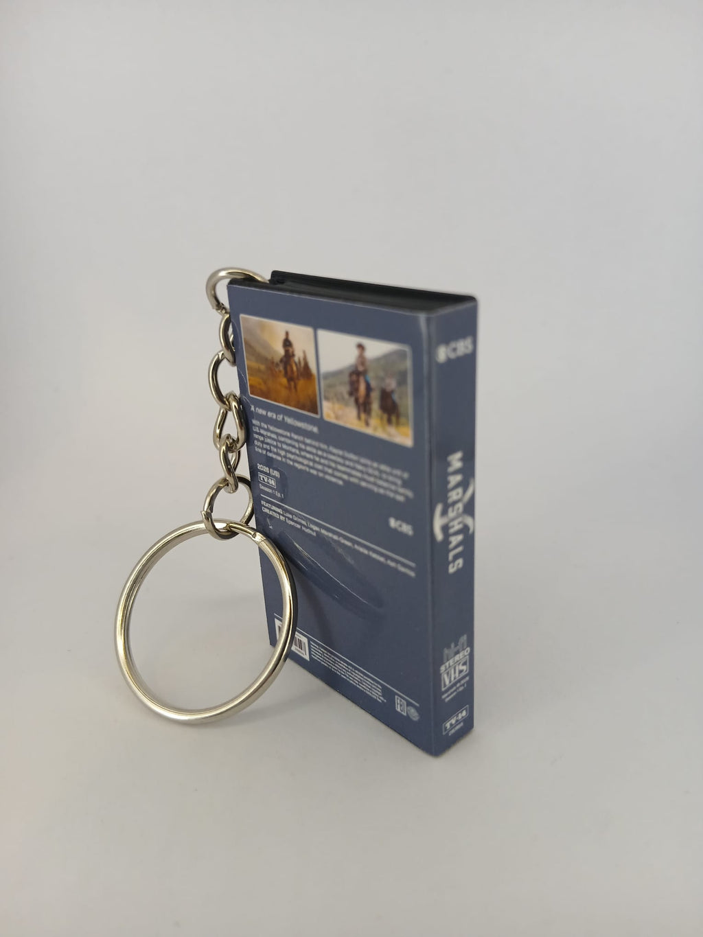 Marshals: A Yellowstone Story VHS keyring — front and spine flat lay angled