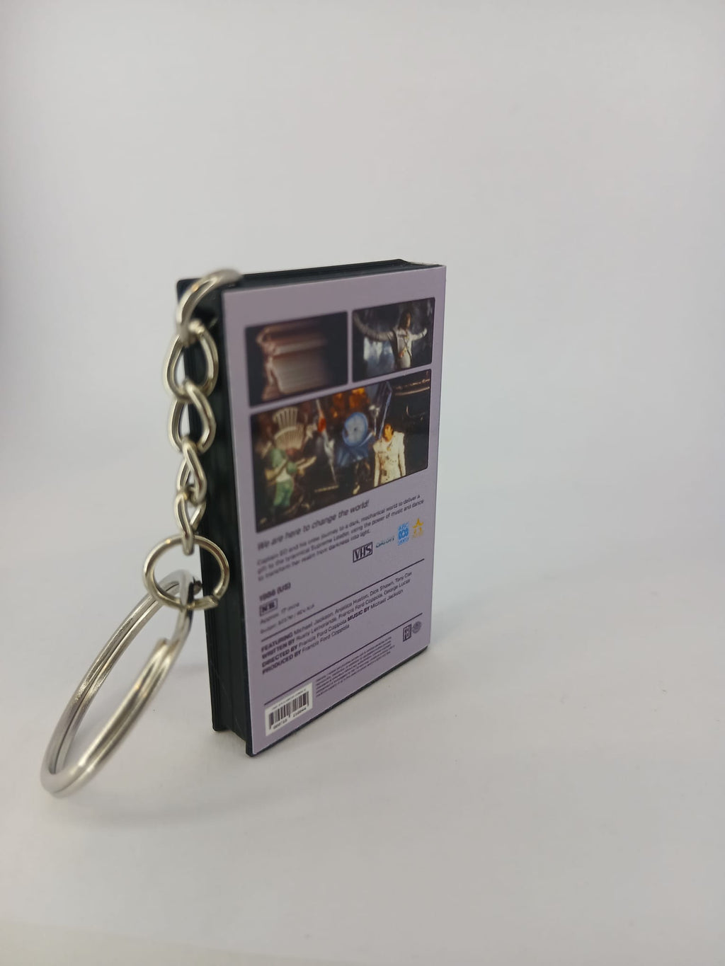 Captain EO VHS keyring — spine view standing