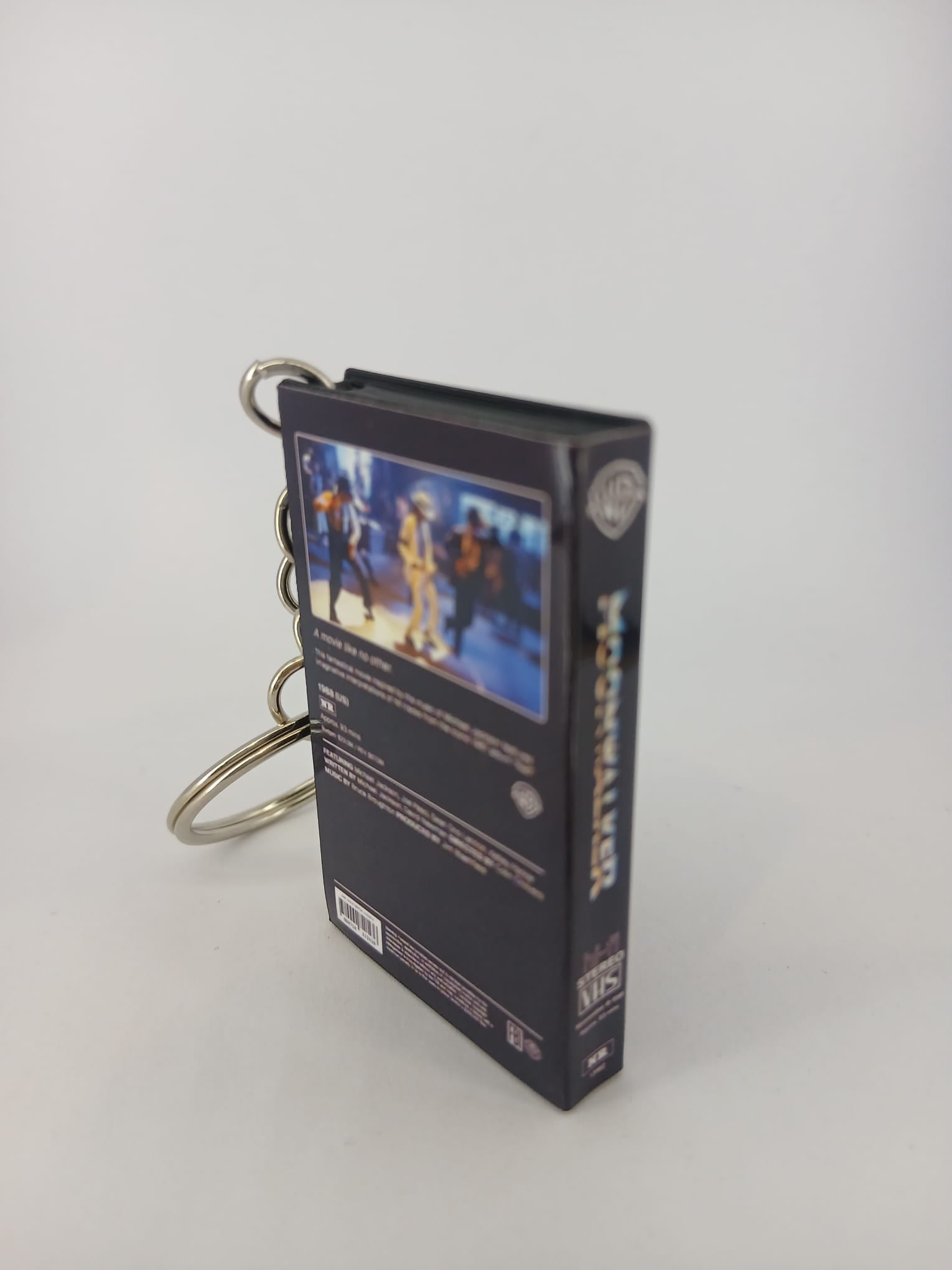 Moonwalker VHS keyring — front cover standing angled