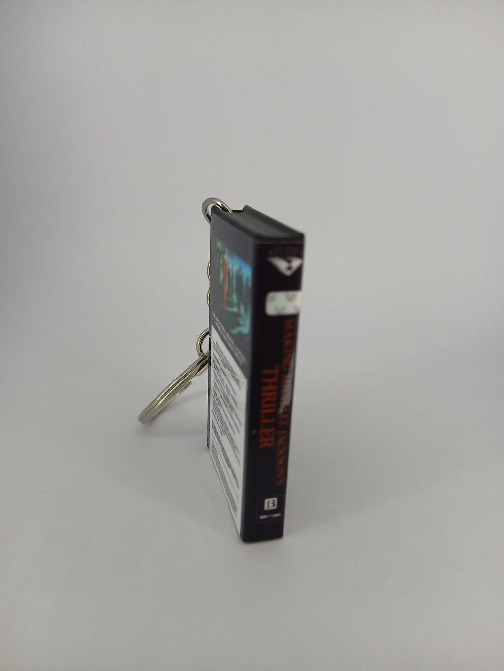 Making Michael Jackson's Thriller VHS keyring — front and spine angled view standing