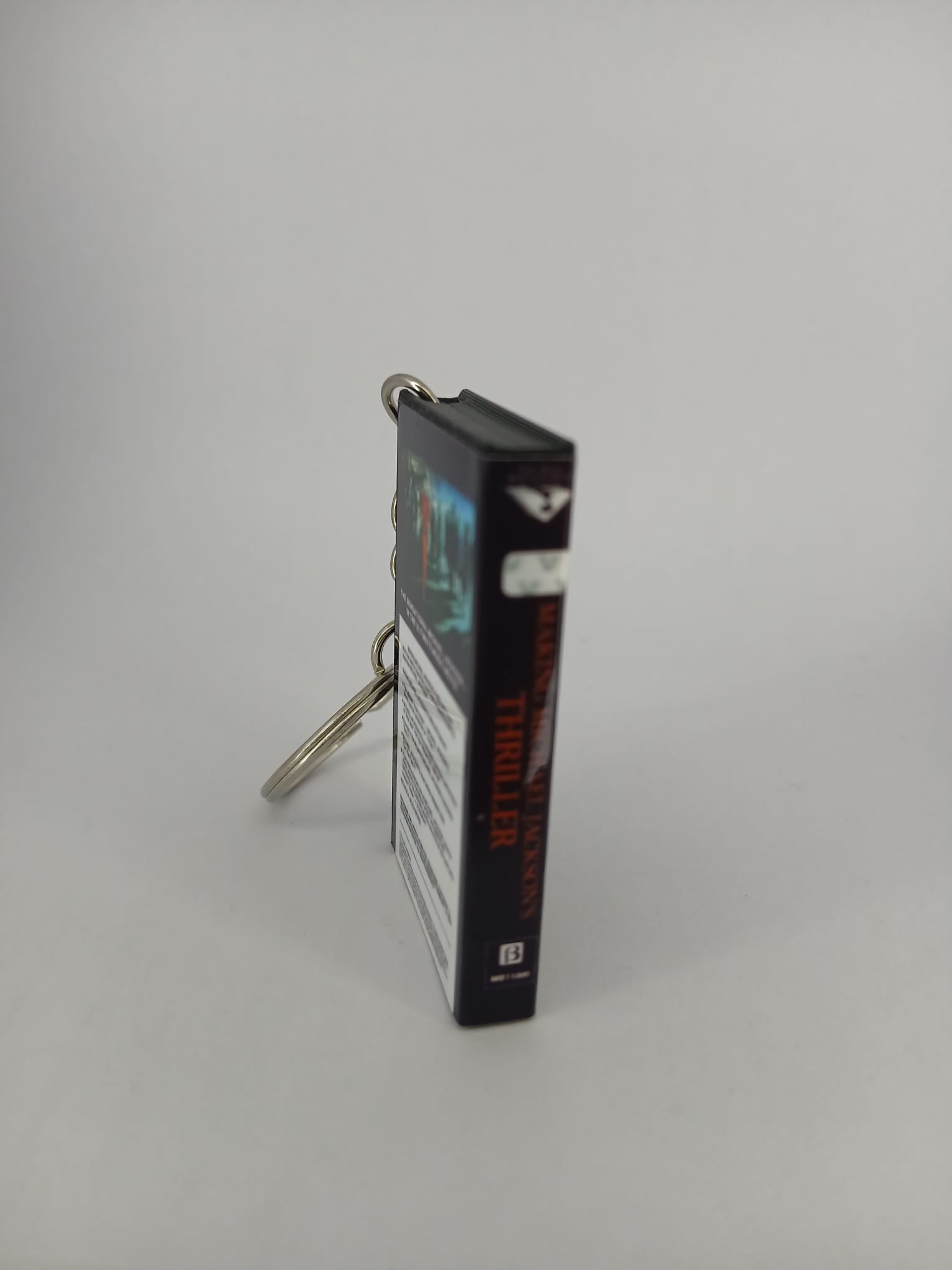 Making Michael Jackson's Thriller VHS keyring — front and spine angled view standing