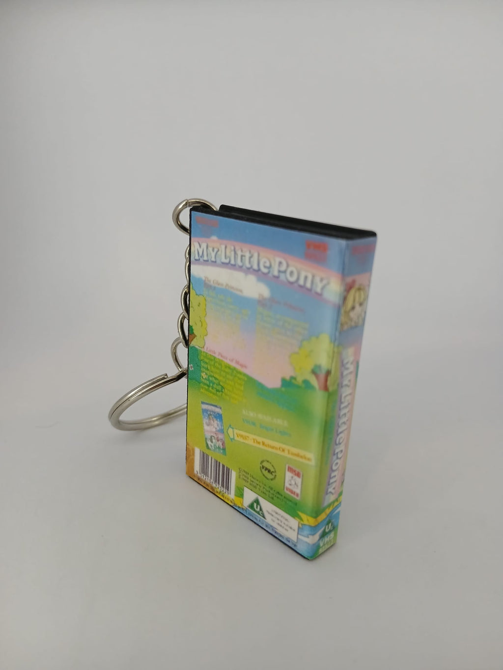 My Little Pony VHS keyring — front and spine angled view standing