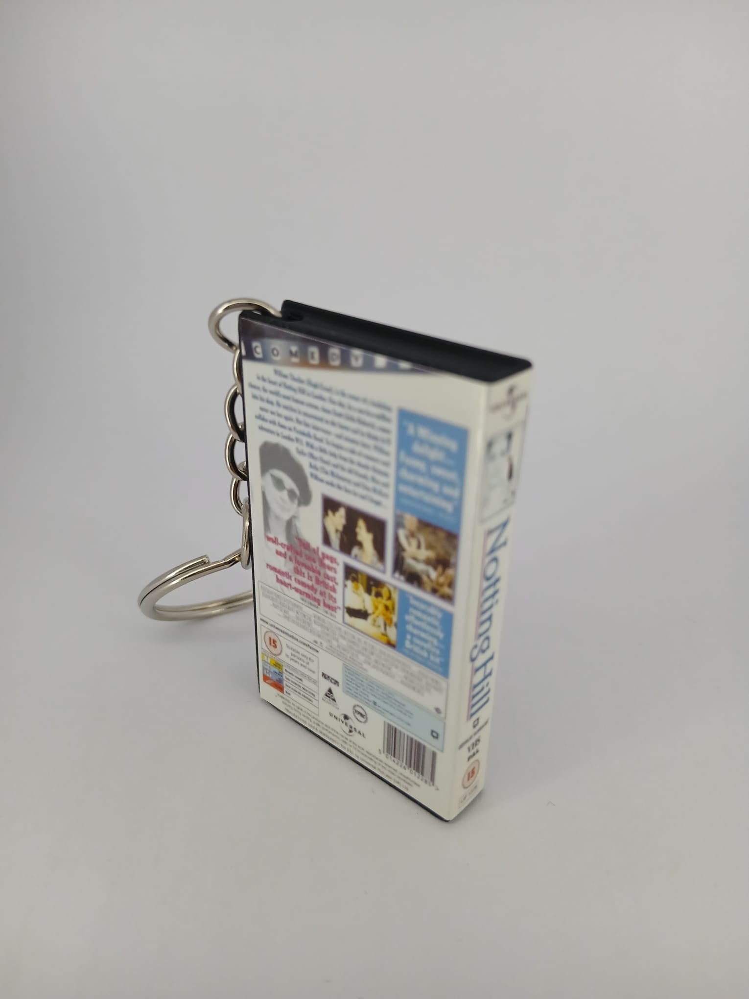 Notting Hill VHS keyring — front and spine angled view standing