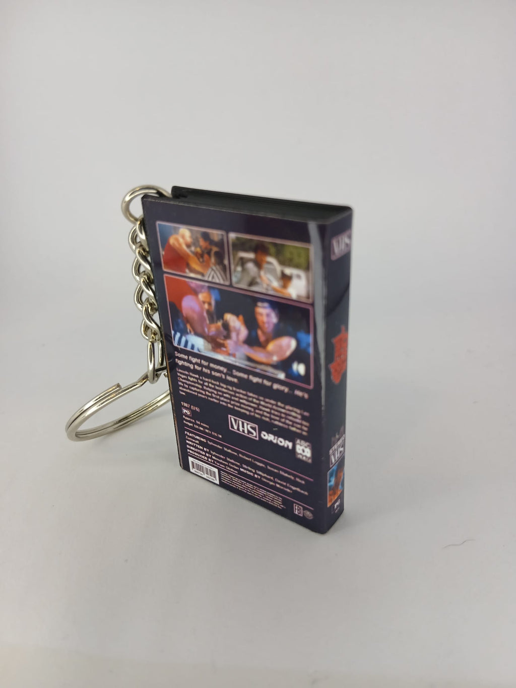 Over the Top VHS keyring — front and side view
