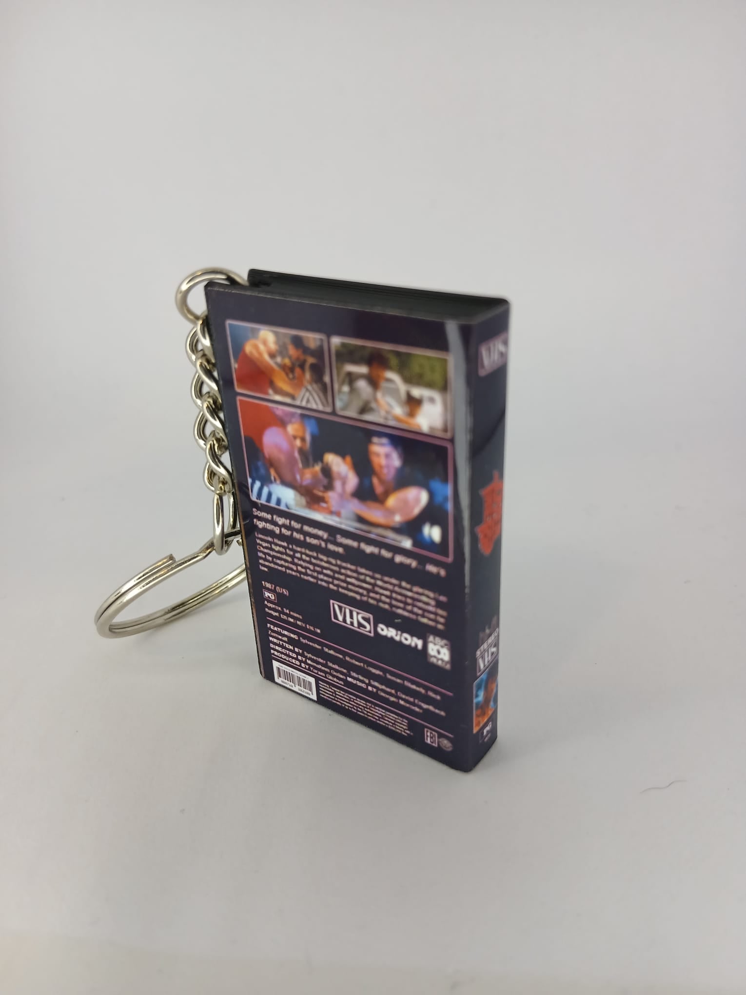 Over the Top VHS keyring — front and side view