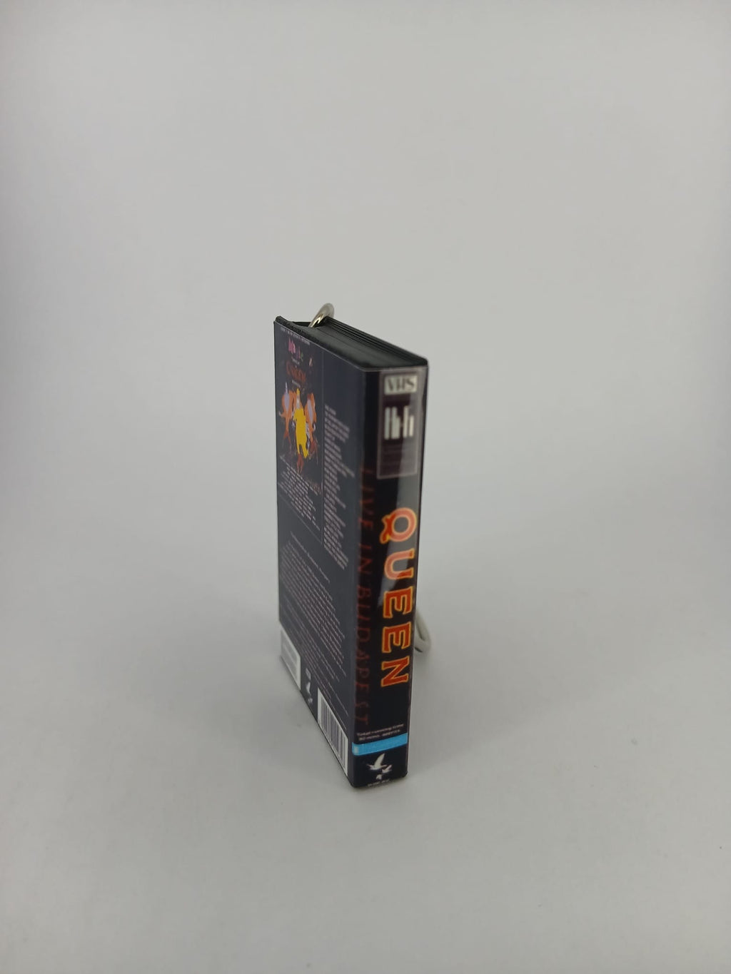 Queen Live in Budapest VHS keyring — back cover angled view standing