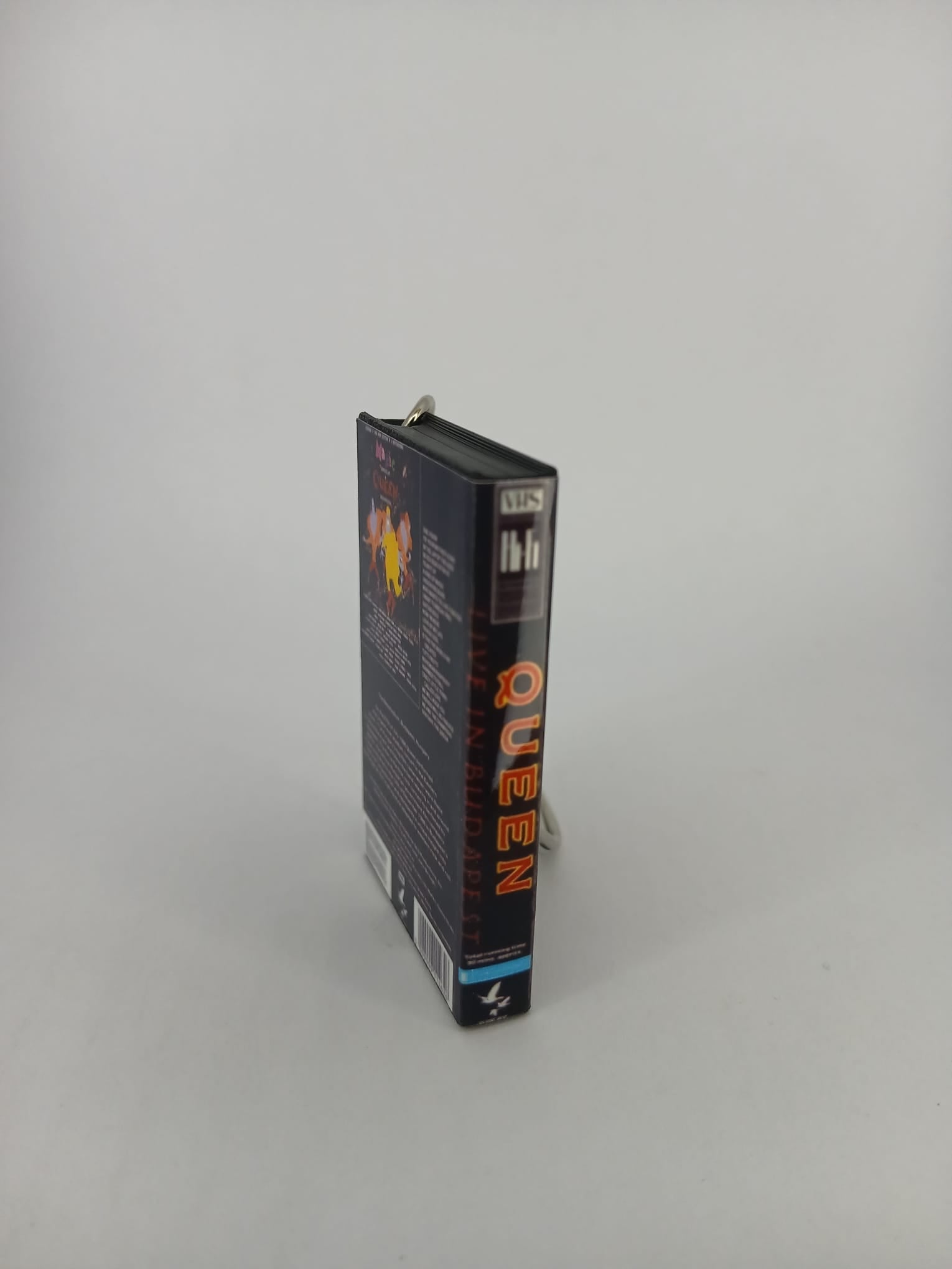 Queen Live in Budapest VHS keyring — back cover angled view standing