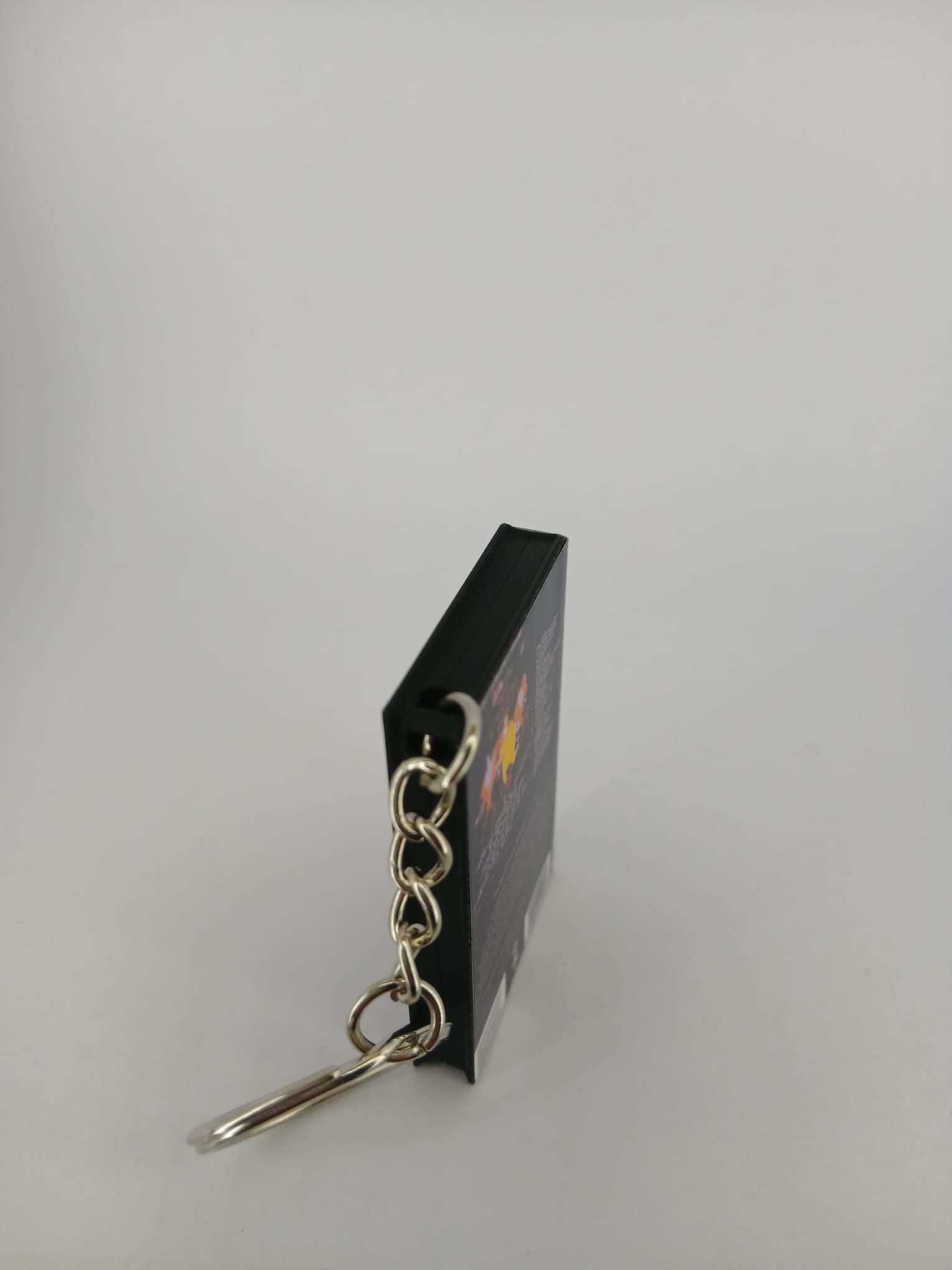 Queen Live in Budapest VHS keyring — back and spine angled view standing