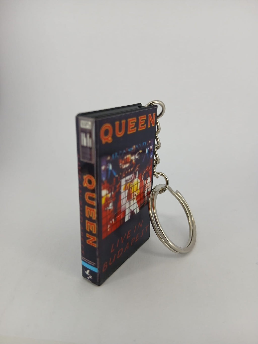 Queen Live in Budapest VHS keyring — front cover standing angled 2